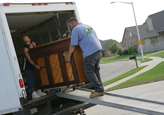 Moving company Abilene workers loading and unloading moving truck efficiently