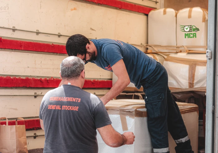 Local movers Buffalo workers carefully packing household and office items for relocation